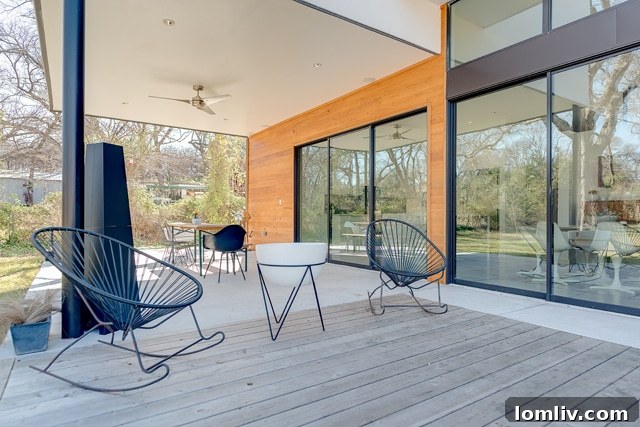 The master bedroom of the Easton Road home, designed to evoke a 'treehouse' feel with expansive windows.