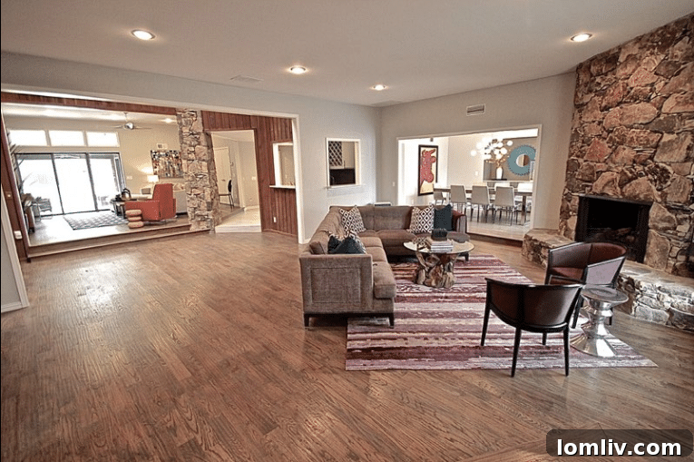 Kevin Twitty's Dream Reno Hits Market Wednesday 14 Detail of the living room, highlighting the fine wool rug and natural driftwood coffee table.