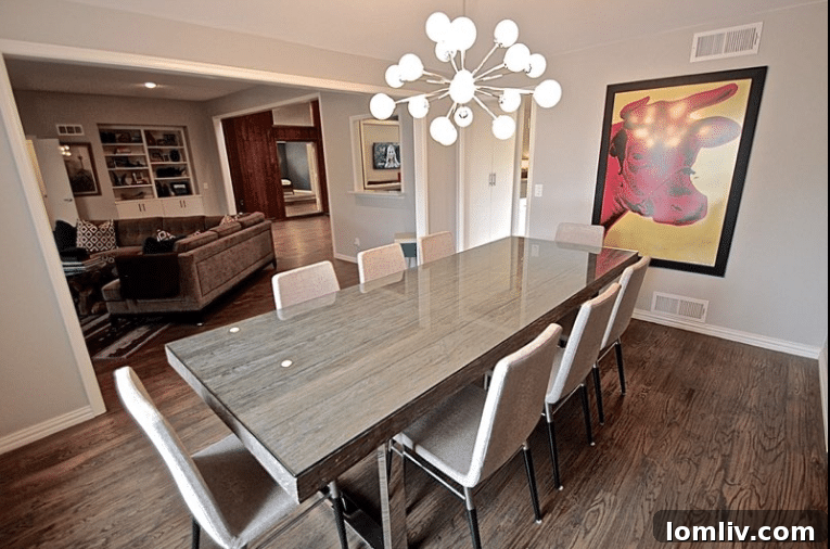 Close-up of the Mid-Century style dining chairs and wood planked table.