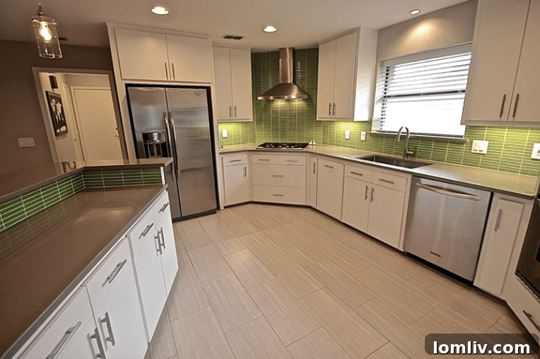 Kevin Twitty's Dream Reno Hits Market Wednesday 20 Modern kitchen with vibrant green backsplash, flat-front cabinets, and recycled quartz countertops.