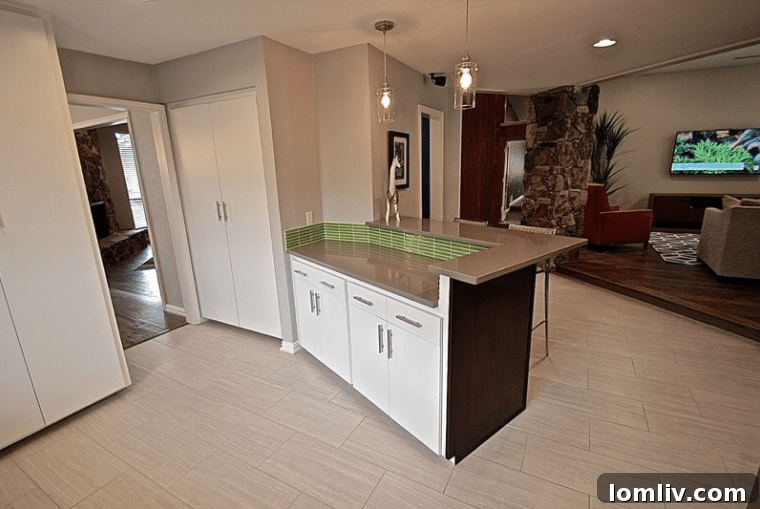 Kevin Twitty's Dream Reno Hits Market Wednesday 22 Close-up of the green tile backsplash and modern KitchenAid appliances.