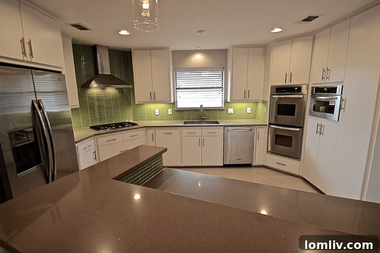 Kevin Twitty's Dream Reno Hits Market Wednesday 23 Corner view of the renovated kitchen, showcasing the new cabinetry and lighting.