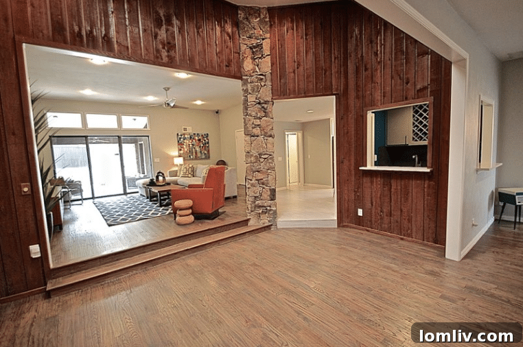 Kevin Twitty's Dream Reno Hits Market Wednesday 28 Eclectic family room with a custom cobalt blue rug, live edge coffee table, and comfortable seating.