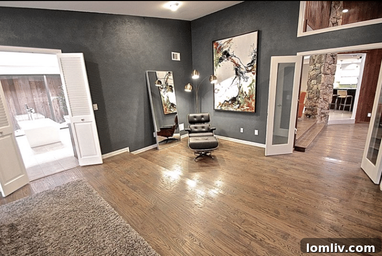 Kevin Twitty's Dream Reno Hits Market Wednesday 34 Contemporary artwork by Jinlu enhancing the sitting area in the master suite.