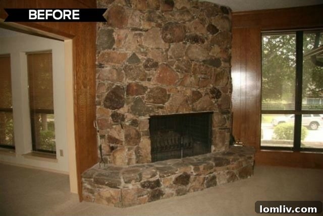 Kevin Twitty's Dream Reno Hits Market Wednesday 5 Dated fireplace in the living room before renovation, featuring traditional stonework.