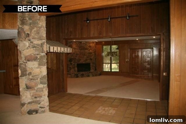 Kevin Twitty's Dream Reno Hits Market Wednesday 8 Secondary view of the living room before renovation, showing dated fixtures and finishes.