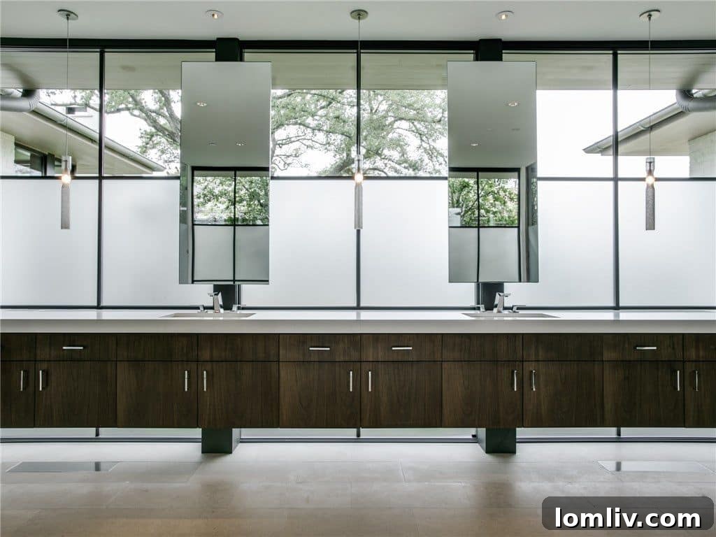 Luxurious master bathroom with ample natural light, modern fixtures, and privacy features.