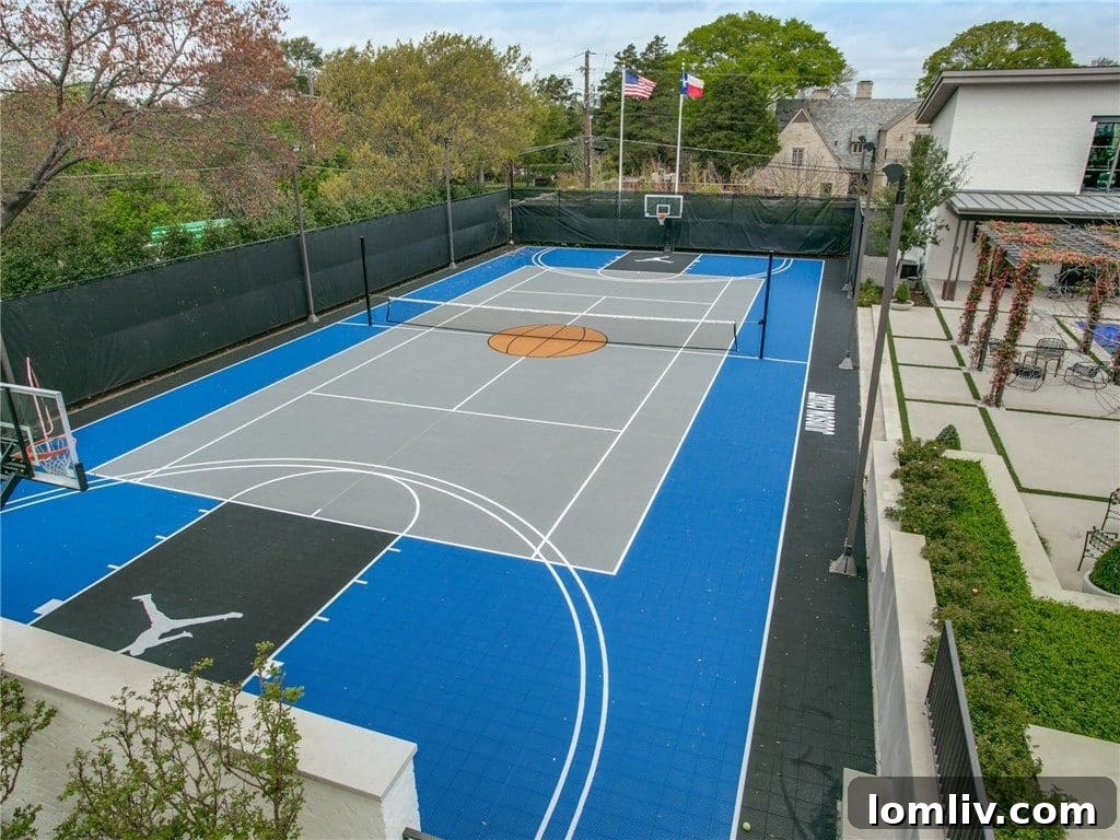 Large sports court in the luxurious backyard of the Texas Modern home, offering recreational opportunities.