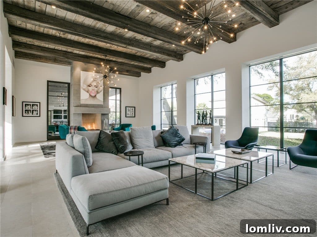 Interior view of the great room with high ceilings, featuring unique reclaimed wood beams and a contemporary design.