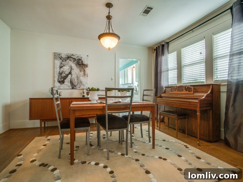 The dining room at 307 N. Waverly transformed with the addition of curtains, rugs, and art, including thrift store silver accessories, making a significant visual difference.