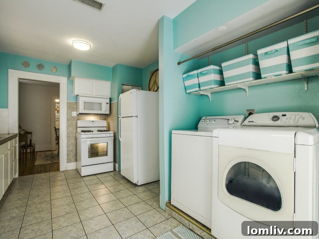 The kitchen at 307 N. Waverly after staging, featuring an inexpensive rug and budget-friendly organizer baskets, showcasing an enhanced and stylish space.