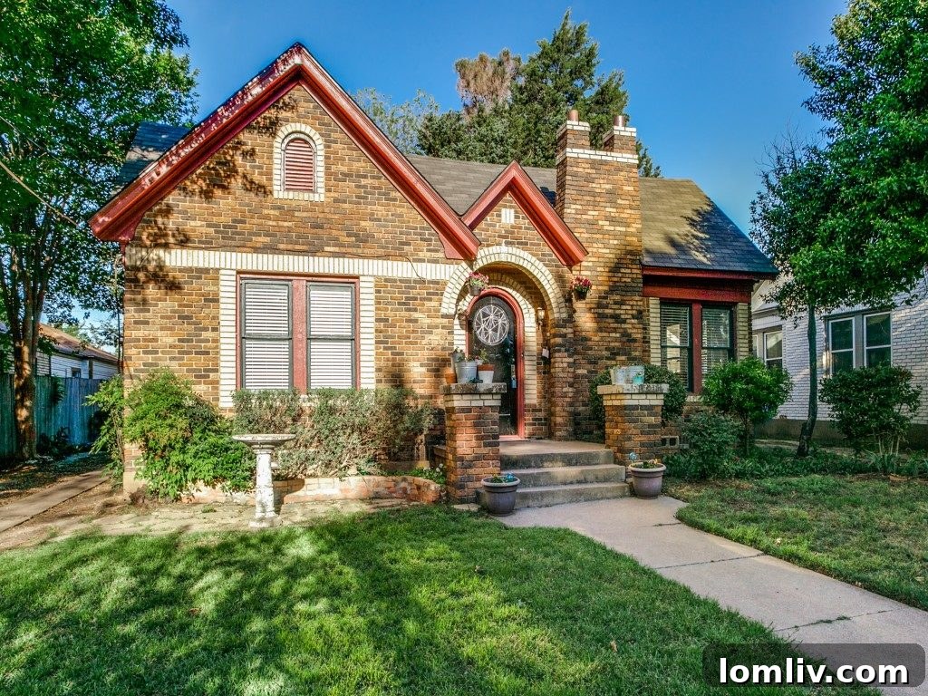 Unstaged exterior of 307 N. Waverly Dr, a charming Tudor in North Oak Cliff with potential