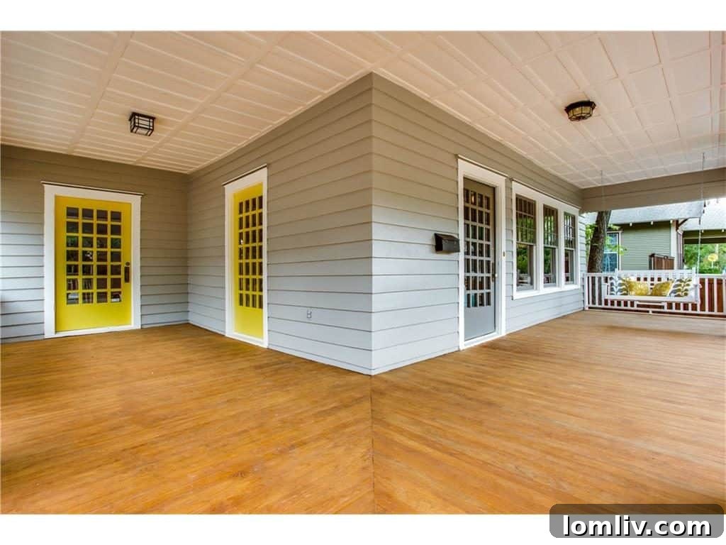 Inviting front porch of a renovated Craftsman home in Dallas