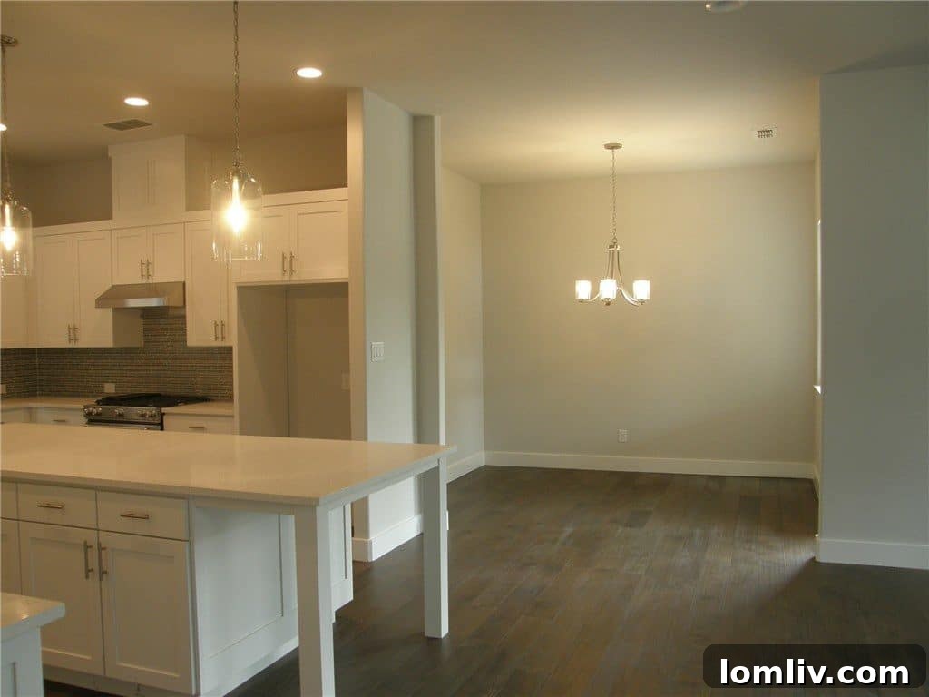 Spacious, open-concept kitchen with quartz countertops in Dallas home