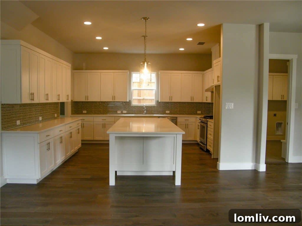 Contemporary kitchen design with ample cabinetry and island seating