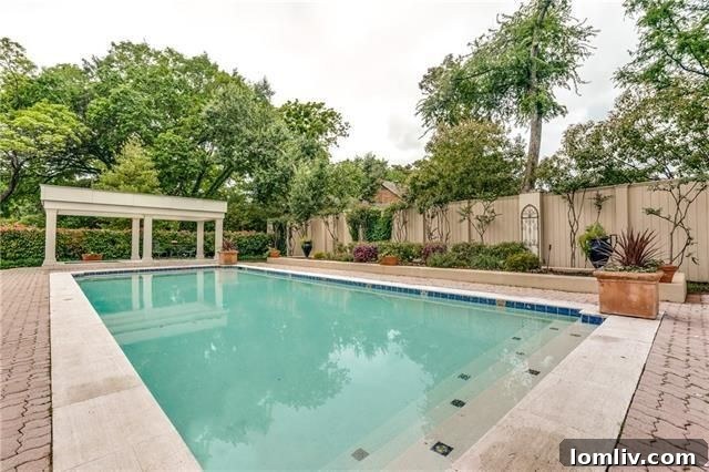 Dining area with abundant natural light overlooking the lush landscape