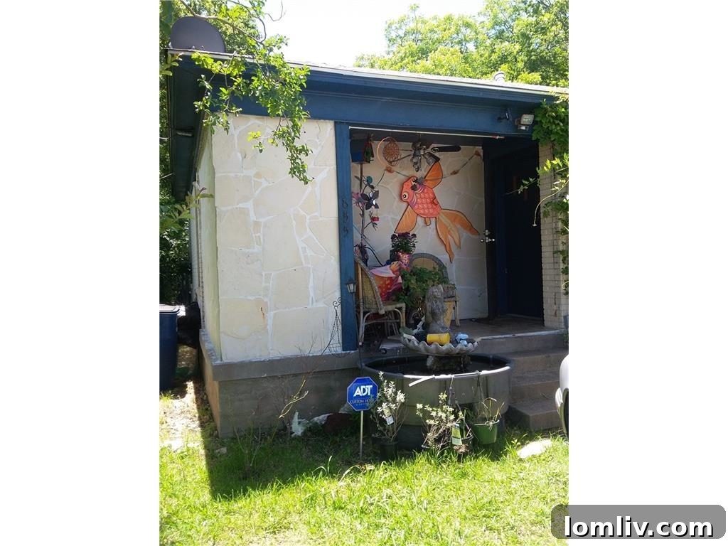 Front exterior of a charming brick home at 655 Peavy Road in Lake Highlands Estates, Dallas