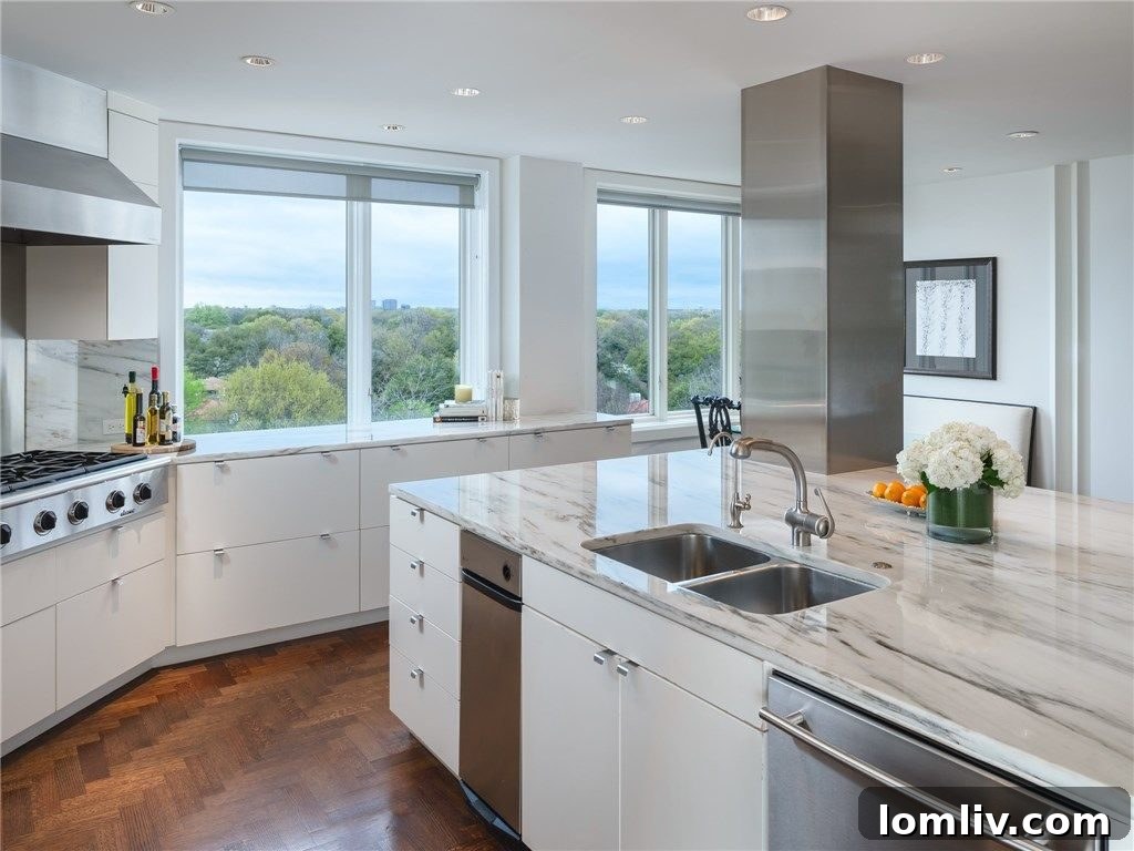 Spacious kitchen with modern amenities, a built-in banquette, and large windows overlooking lush greenery.