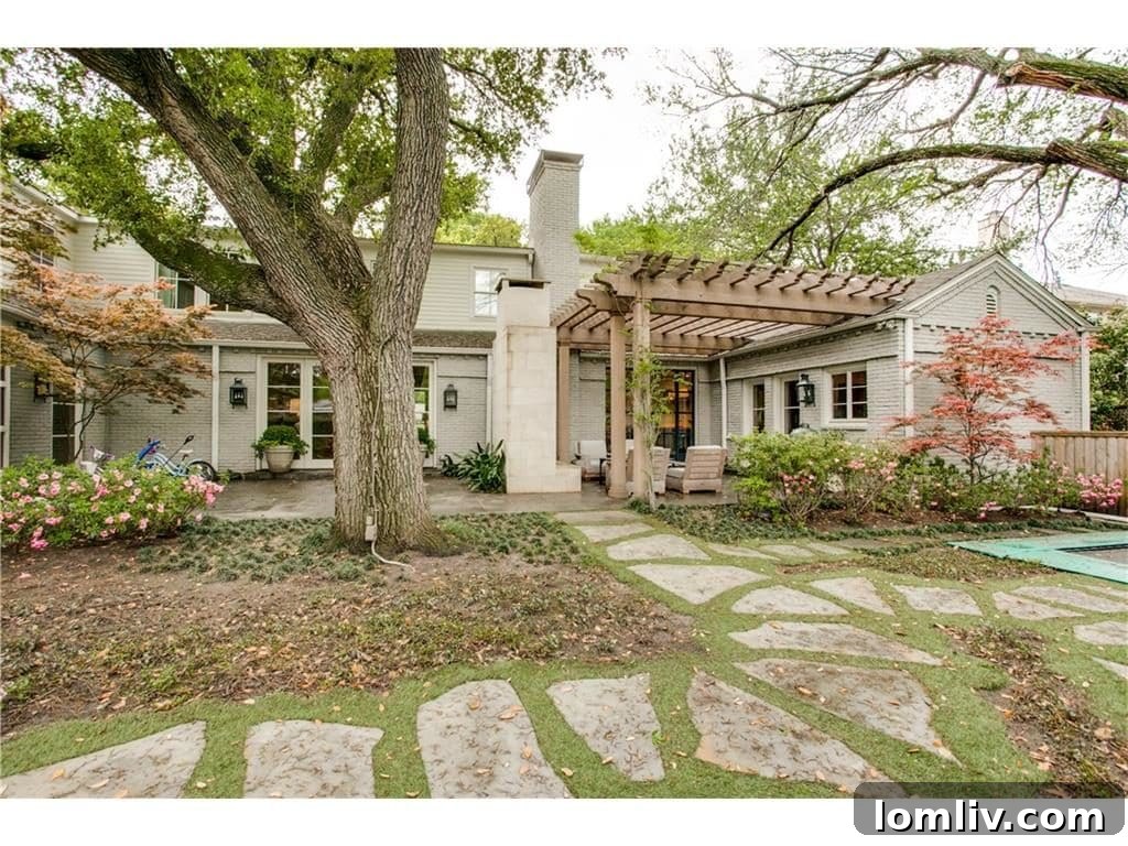 Greenway Parks Reimagined: A Designer's Modern Traditional Vision 21 Outdoor Entertainment Area with Fireplace and Pergola