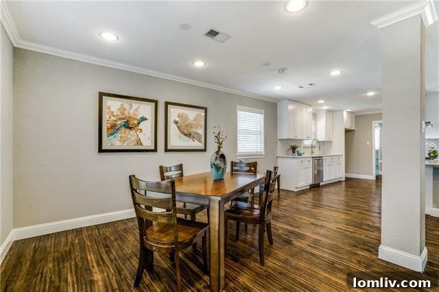 Elegant Arabesque Tile Backsplash and Stainless Steel Appliances