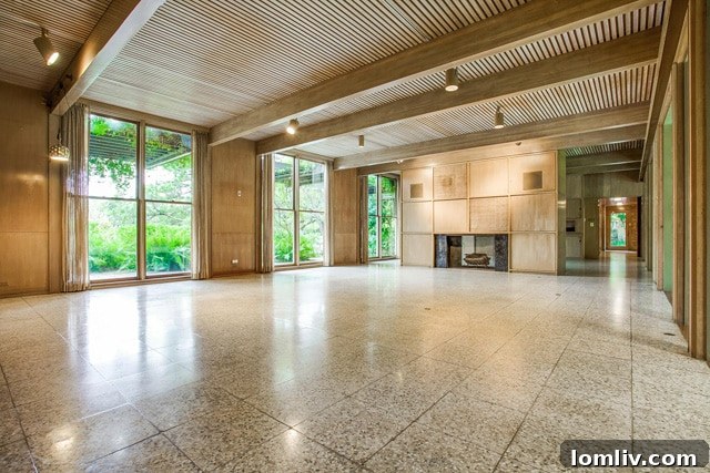 Spacious living and dining area with unique reeded wood ceilings at 3756 Armstrong Ave, awaiting modern touches.