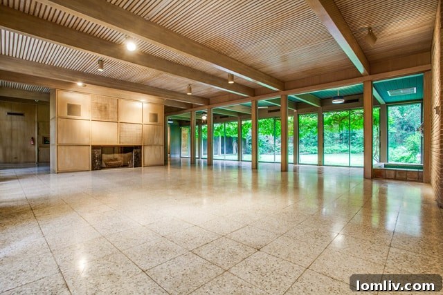 The enclosed patio at 3756 Armstrong Ave, showing potential for restoration of its original outdoor fountain and pillars.