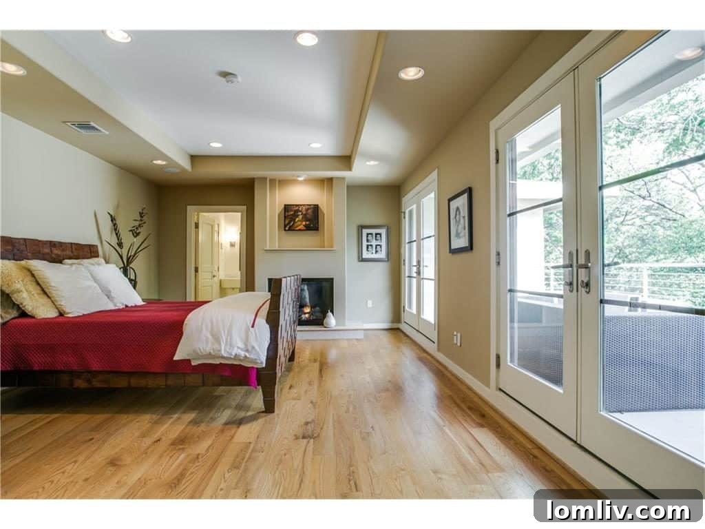 Luxurious master retreat with private balcony overlooking the backyard and pool