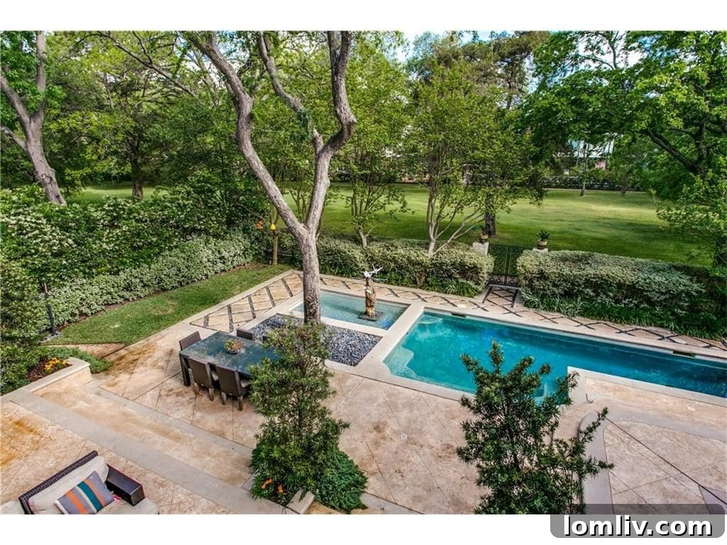 Expansive outdoor entertaining area with a fully equipped kitchen, mosquito misting system, and LED lighting