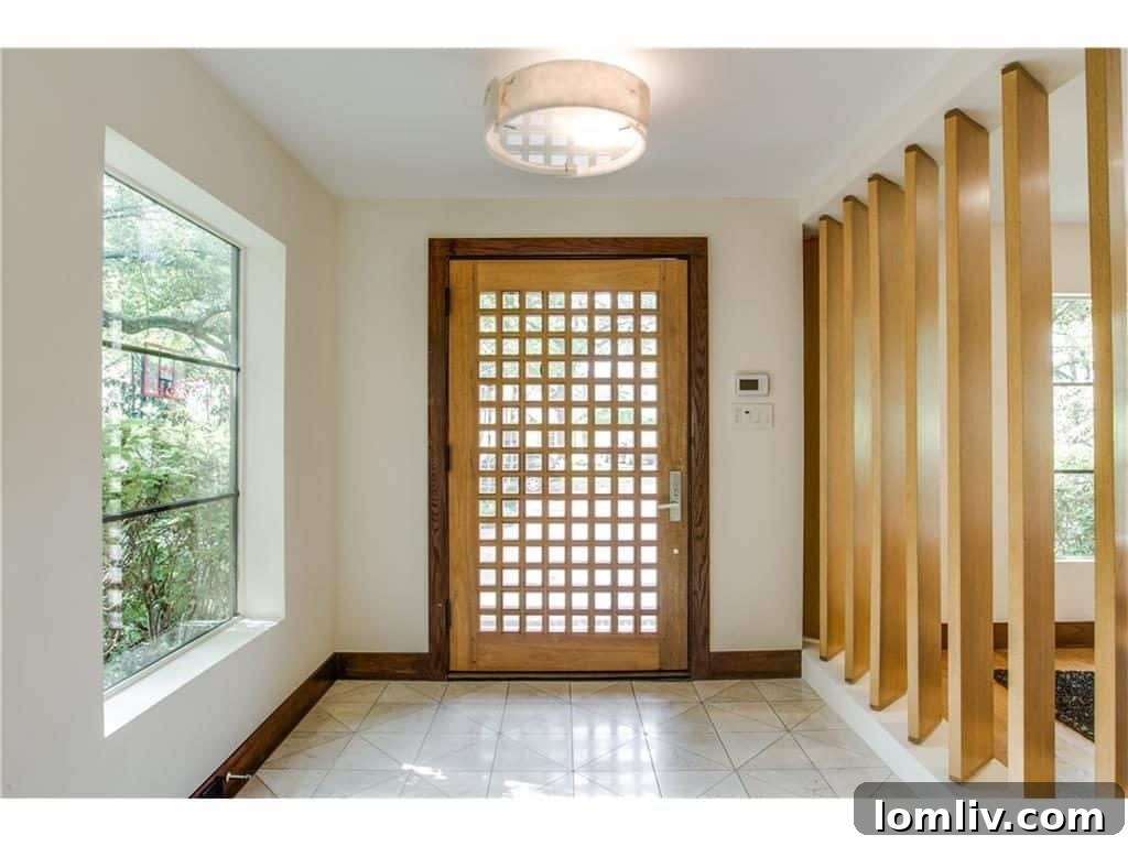 Close-up of the elegant metal staircase, a seamless blend of original and custom fabricated elements