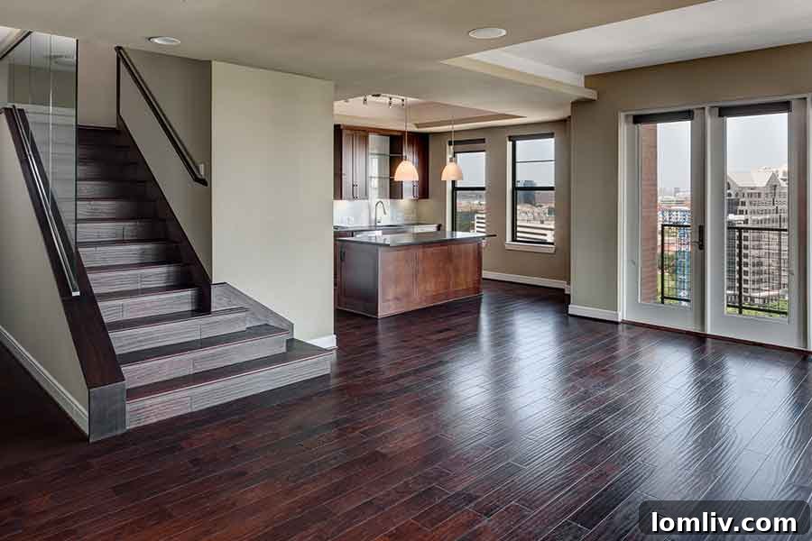 High-end kitchen with stainless steel appliances and island at Taylor Luxury Apartments