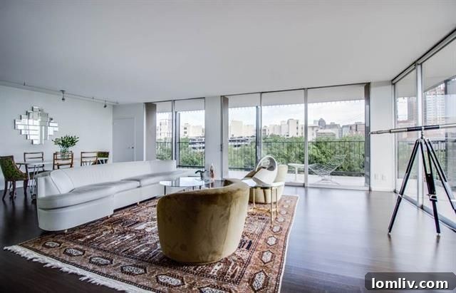 Stunning high-rise condo in Uptown Dallas with panoramic city and park views from its expansive wraparound balcony.
