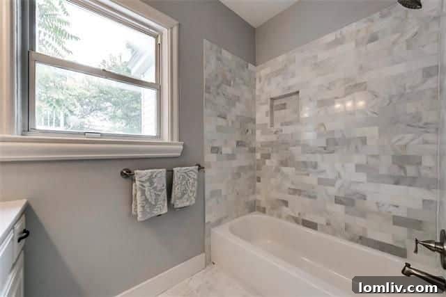 Master bedroom featuring trendy barn doors, a large walk-in closet, and a spa-like en-suite bathroom.