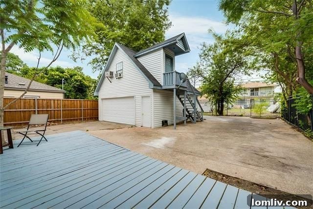 Backyard deck and separate guest quarters above a two-car garage, offering versatile living space.