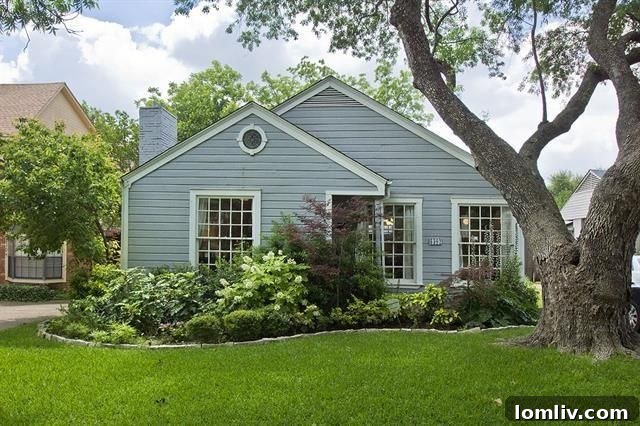 Charming 1940s bungalow in Dallas with meticulously maintained exterior and lush front garden.