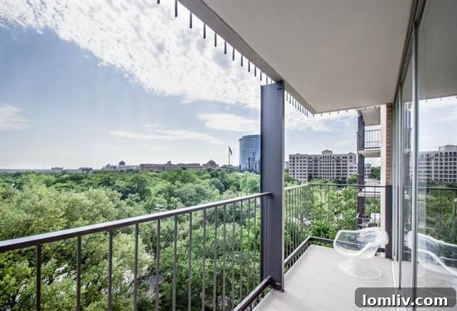 Spacious open concept living area leading to a wraparound balcony with stunning views of Dallas.