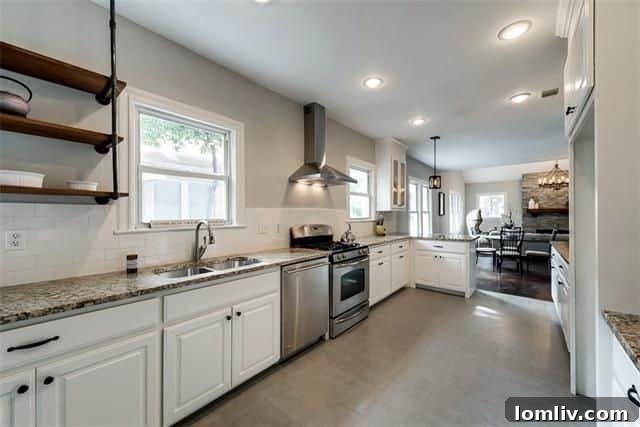 Stylish country-style kitchen with new granite countertops, white cabinets, and stainless steel appliances.
