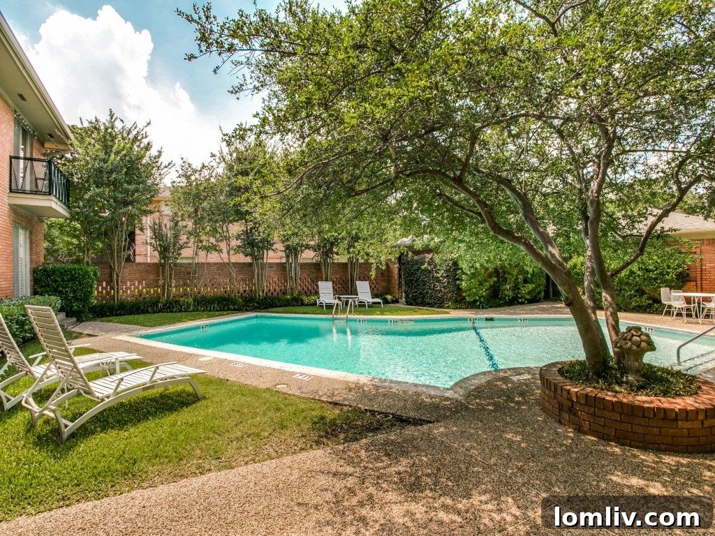 Charming outdoor seating area nestled amidst the lush landscaping, providing a peaceful and comfortable spot for residents to relax and socialize