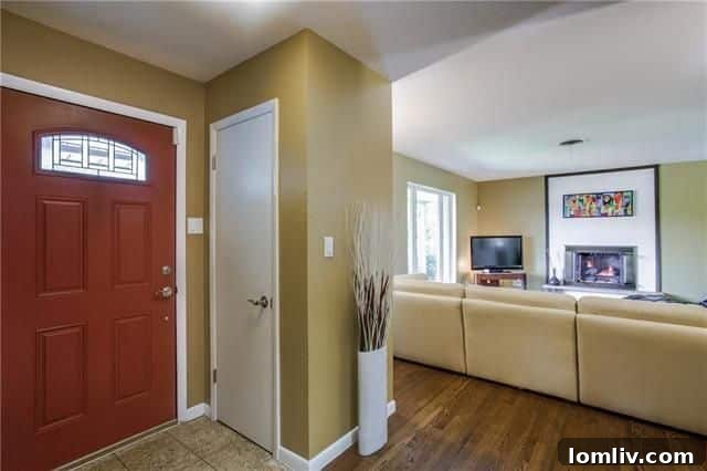 Bright and Spacious Living Room with Hardwood Floors and Large Window