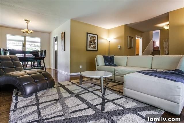 Elegant Dining Area with Hardwood Floors Flowing from the Kitchen