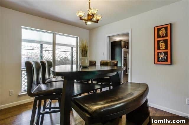 Cozy Wood-Paneled Second Living Area or Den, Offering Versatile Space