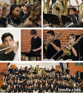 The award-winning William B. Travis Academy/Vanguard band members pose with their instruments and awards.