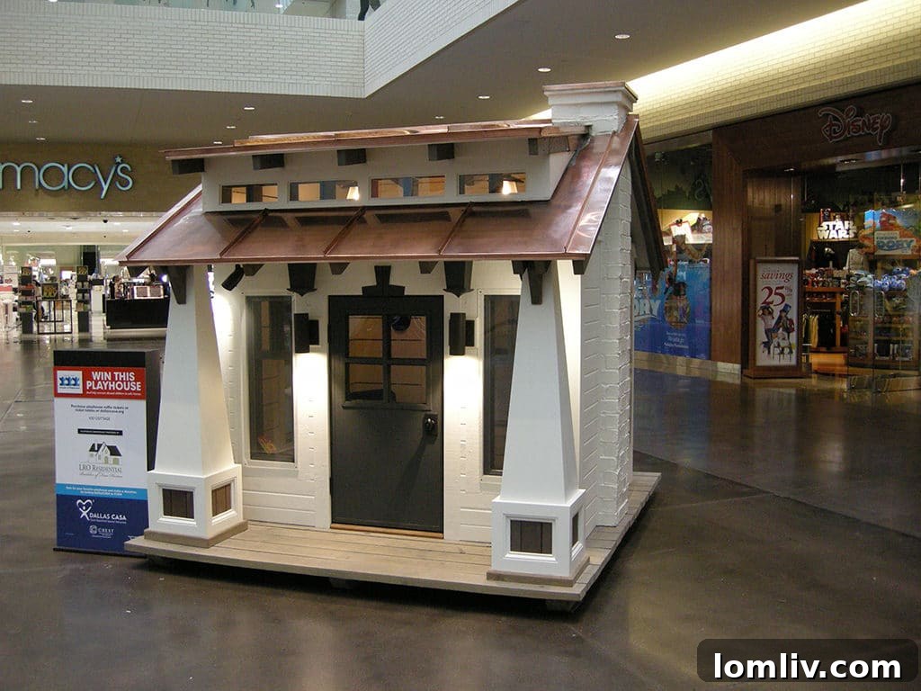 The charming Kid Cottage by LRO Residential, a delightful and inviting playhouse featured at the Dallas CASA Parade of Playhouses, perfect for imaginative young minds.