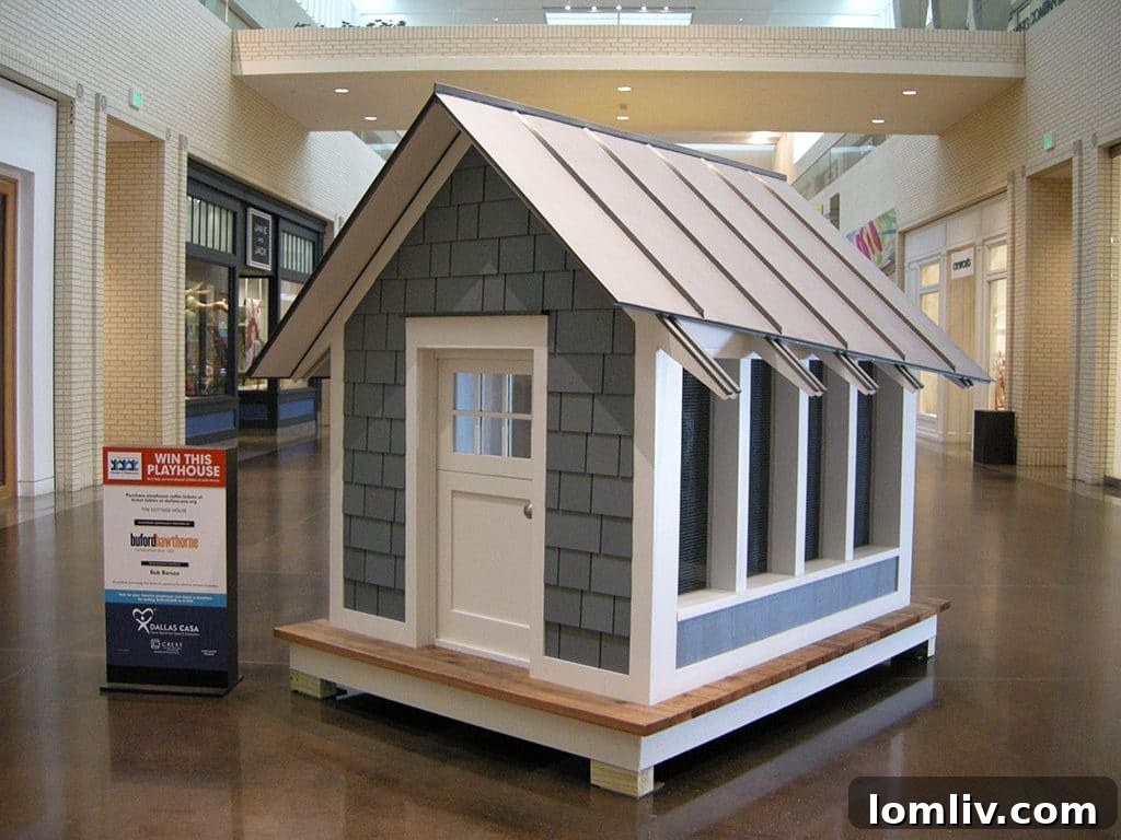 The Cottage House by Buford Hawthorne with Bob Borson, a beautifully crafted playhouse from the Dallas CASA Parade of Playhouses, combining classic design with playful elements.