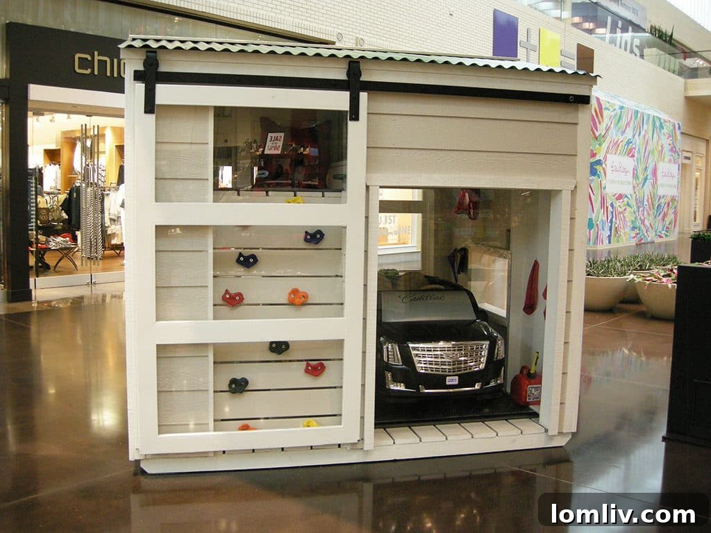 The CREST CASA GARAGE playhouse by Crest Cadillac/Crest Infiniti with Creative Millworks LLC and McPeak Innovative Solutions, a sleek and modern design at the Dallas CASA Parade of Playhouses.