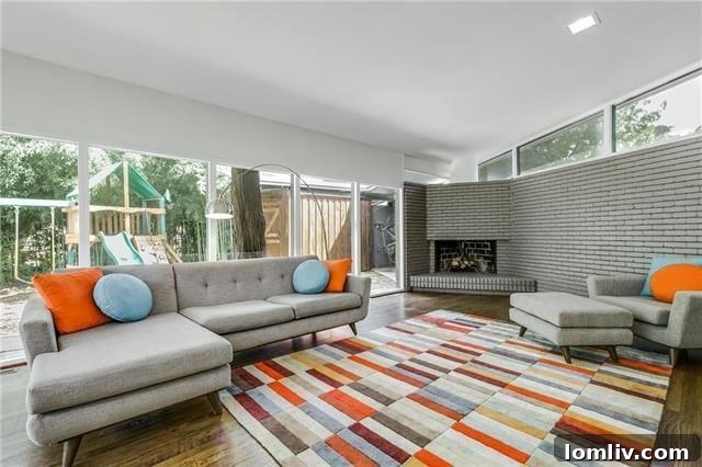 Spacious living room with floor-to-ceiling windows and vaulted ceilings