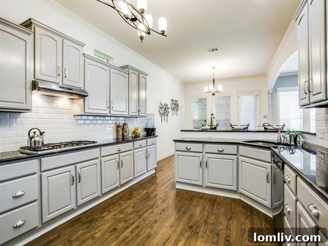 Dining area with wainscoting and large windows at 5918 Llano Ave