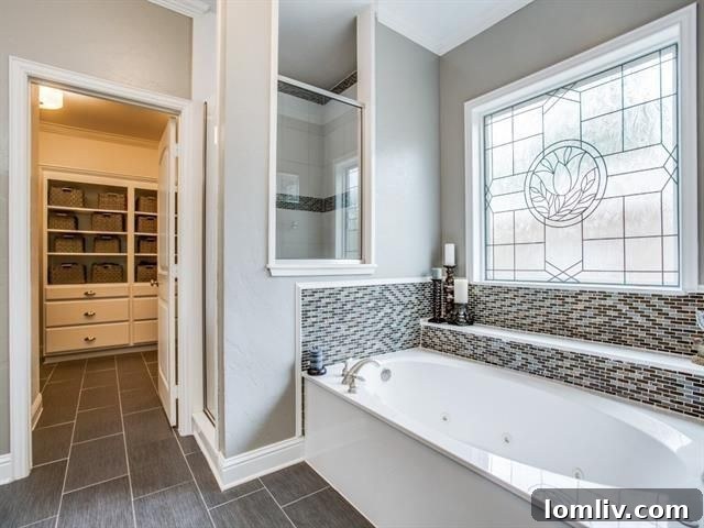 Luxurious master bathroom with modern fixtures at 5918 Llano Ave
