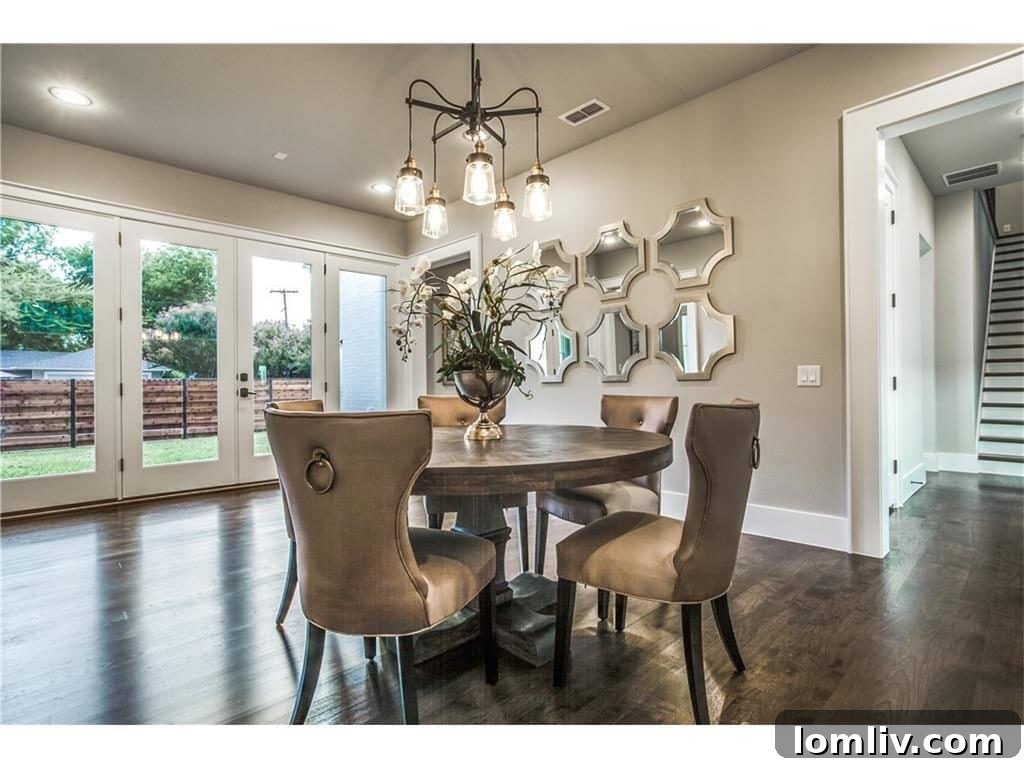 Cambridge Homes' M Streets Modern Farmhouse: Designed with HGTV Flair 6 Luxurious Dining Area Opening to Courtyard, Perfect for Entertaining