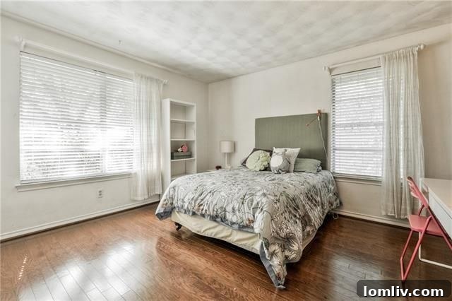Architectural Excellence: Dallas Modern Townhome Tops Our Open House Guide 11 Cozy bedroom with ample natural light