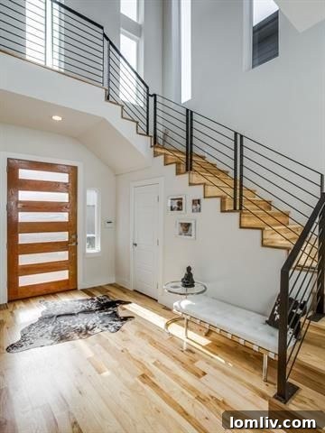 Architectural Excellence: Dallas Modern Townhome Tops Our Open House Guide 14 Stunning entryway with soaring ceilings